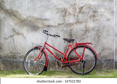 Old Bike Against The Wall At Home