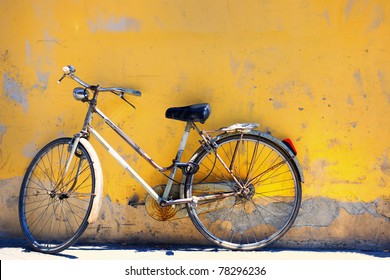 Old Bike Against The Wall At Home