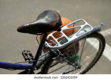 Old Bike Seat. Retro Bike On Street. Transport Of Bygone Era. Trunk By Private Transport.