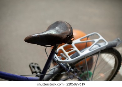 Old Bike Seat. Retro Bike On Street. Transport Of Bygone Era. Trunk By Private Transport.