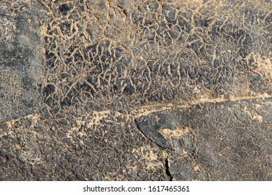 Old bitumen surface with cracks