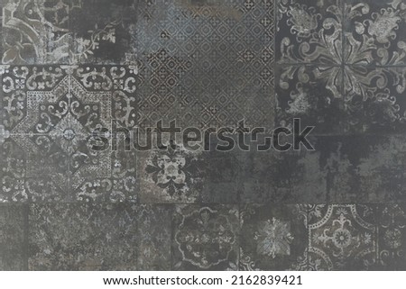 Old black anthracite gray grey vintage worn geometric arabesque shabby mosaic ornate patchwork motif porcelain stoneware tiles stone concrete cement wall texture background