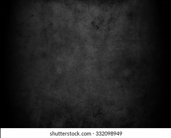 Old black background. Grunge texture. Dark wallpaper. Blackboard. Chalkboard. Concrete