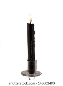 Old Black Candle Isolated Over White Background