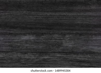 Old black color wood wall for seamless wood background and texture.
