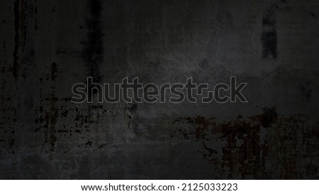 old black concrete wall of ancient architecture, cracked and dirty wall texture use as background with blank space for design. dirty dark black grunge cement with rust. vintage background.