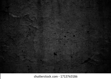 Old black concrete wall texture. Grunge background. Blackboard. 