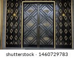 
Old black and gold art-deco door. Frontage on street.