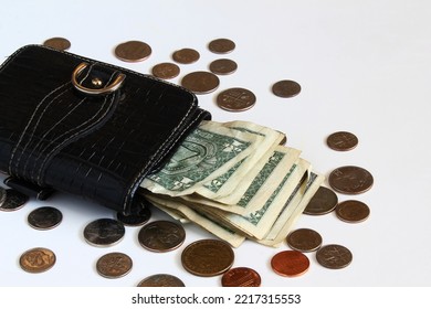 Old Black Leather Purse With Us Dollars Bill And Coin On A White Background With Copy Space,selective Focus