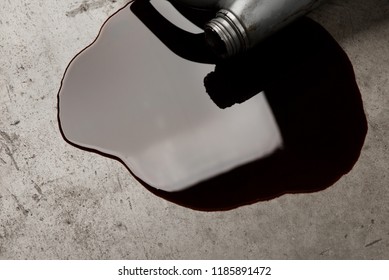 Old Black Oil Lubrication Engine Vehicle Motor Car Used Leak Or Drip Spill From Bottle On Concrete Floor Art Abstract Design Industry Background