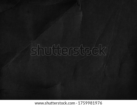 Old black paper texture background. Fold page. Grunge wallpaper. Signboard