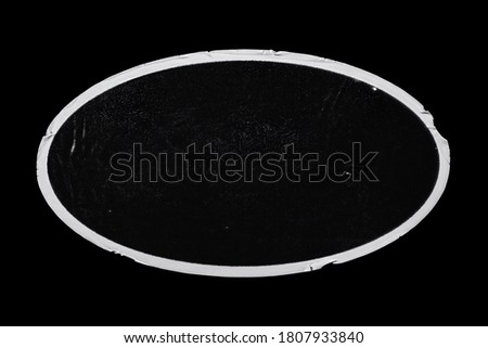 Old Black Peeled Sticker Label Ellipse Oval Grunge Dirty Dusty Surface Isolated on Black Background