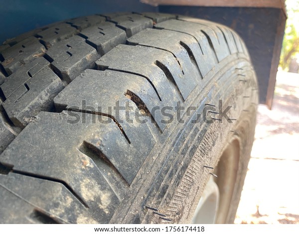 Old\
black tire tread. Change time. Tire tread\
problems.