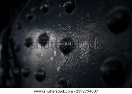  old black train car with close up of rivets 