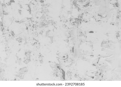 Old black and white dirty tattered paper bulletin board surface texture background.