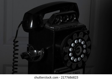 An Old Black And White Off Hook Telephone Closeup.