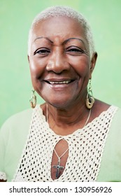 Old Black Woman Portrait, Lady In Elegant Clothes Smiling On Green Background