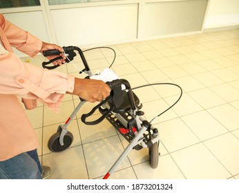 Old Black Woman Walking With A Walker At The Hospital