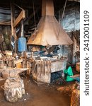 An old blacksmiths forge and workshop full of tools, portrait view. High quality photo