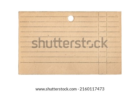Old blank lined index card with round hole isolated on white background. Vintage file cabinet accessory.  Yellowed paper with splashes, lines in gray ink.
