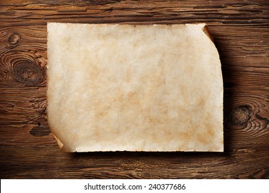 old blank parchment on aged wood background,horizontal - Shutterstock ID 240377686