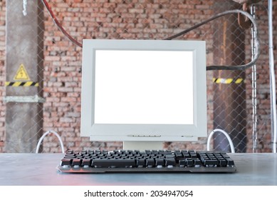 Old Blank Screen Computer Monitor With Copy Space And Keyboard On The Metal Table Front View Background.