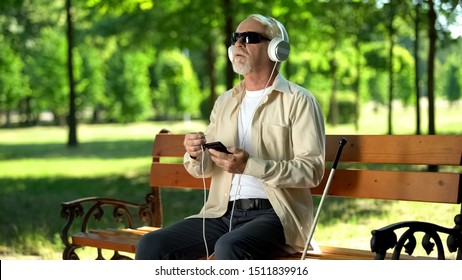 Old Blind Man Putting Headset Cable In Phone, Listening Voice Message, Audiobook