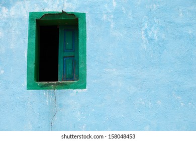 Old Blue Adobe Wall With A Window. Architecture Background.