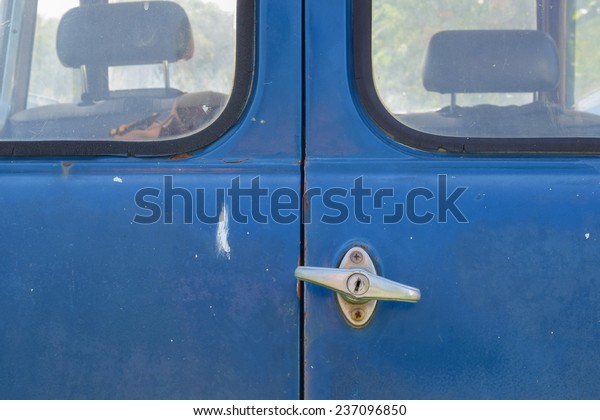 old blue car door is
lock