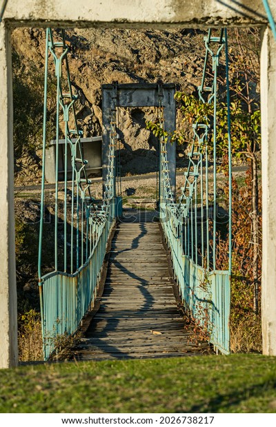 Old blue metal\
and wood suspension bridge over a tributary of the Arda river near\
Kardzhali in southern\
Bulgaria