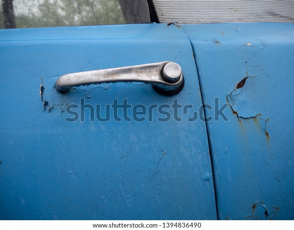 Old blue rusty\
french car detail door knob