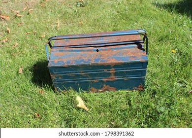 An Old, Blue And Rusty Toolbox