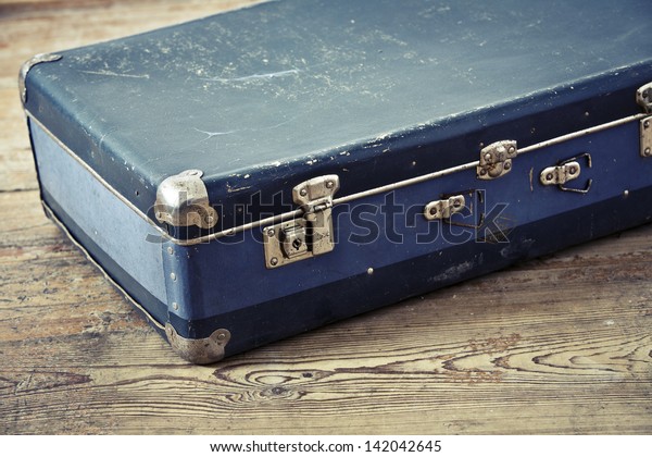 old blue suitcase