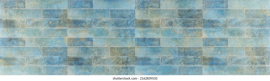 Old blue turquoise aquamarine colored vintage worn geometric shabby mosaic ornate patchwork motif porcelain stoneware tiles stone concrete cement wall texture background panorama