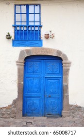 Old, blue, wood door and window. Cuzco, Peru.