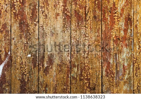Old boards with cracked rusty paint. Textured wooden old background with vertical lines