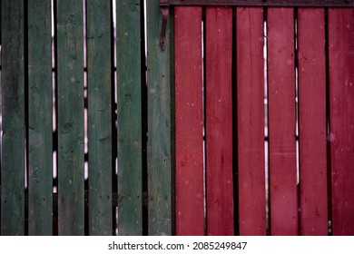 Old boards painted green red. Background texture. High quality photo
