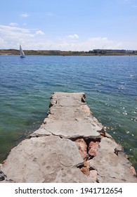 An Old Boat Dock In A Small Bay.