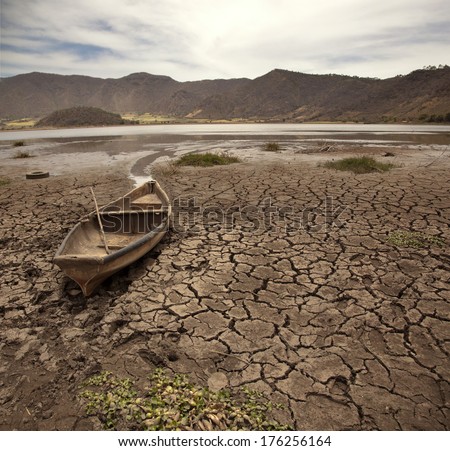 	old boat on dry lake
