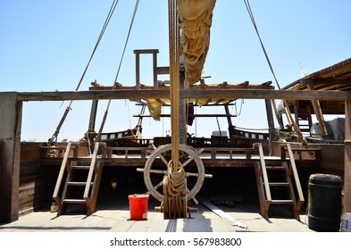 Old boat in The Qatar pearl. - Shutterstock ID 567983800