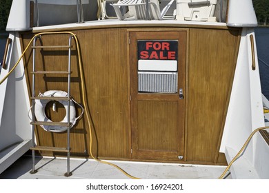 Old Boat With A For Sale Sign.