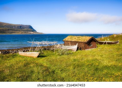 Old Boats And Hut From Sea Sami Culture In Finnmark, Norway