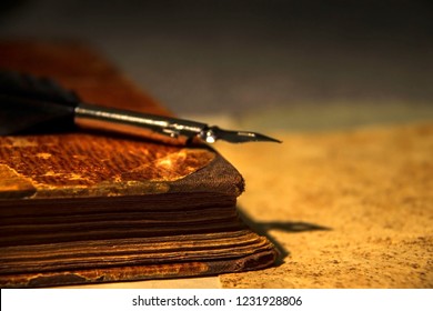 An Old Book And A Feather Quill Pen