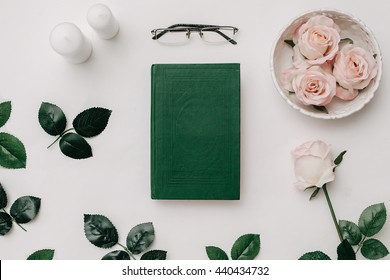 Old Book, Glasses, Pink Roses On White Background. Flat Lay