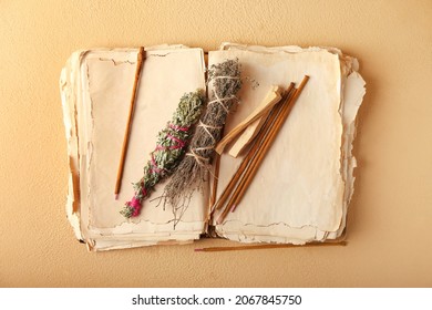 Old Book, Incense And Herbs For Aura Cleansing On Color Background