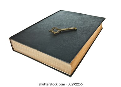 Old book with key isolated on white background