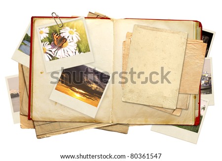 Old book and photos. Objects isolated over white