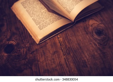 Old Book Wooden Library Desk With Unreadable Text, Retro Toned Image, Selective Focus