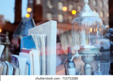 Old Books And Absinthe Decanter In A Bar Window