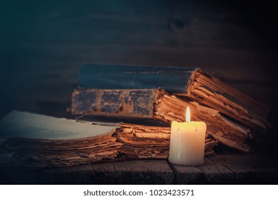 Old Books And Candle.